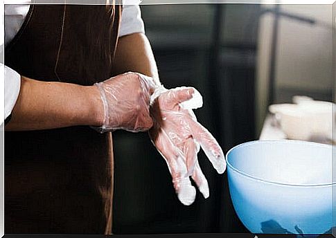 Putting on gloves before cooking