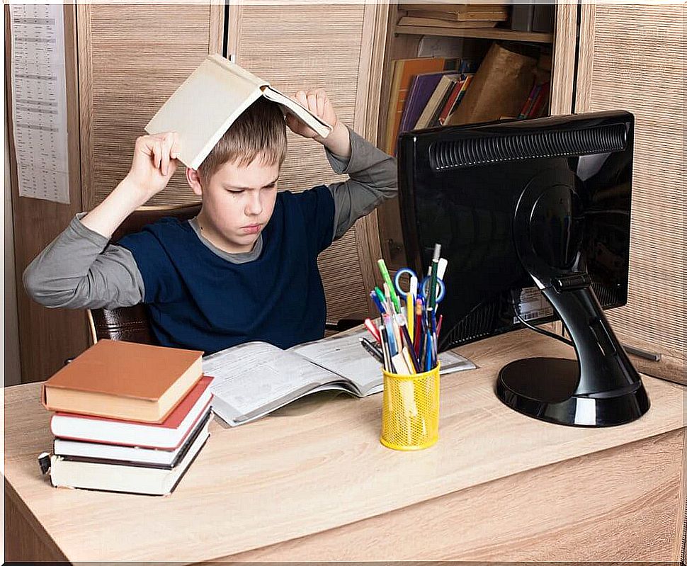 A boy doing homework, unloved children