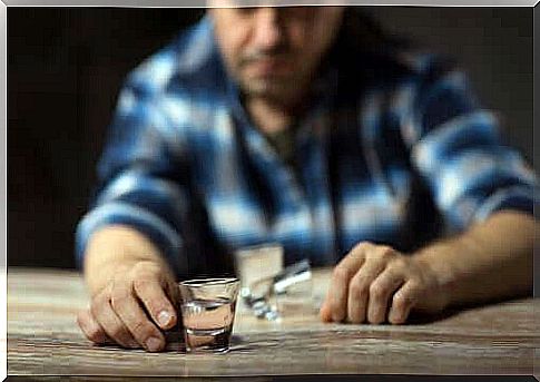 A man reaching for a glass