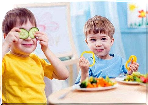 children are playing with their food