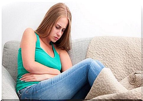 Crouched woman on the couch