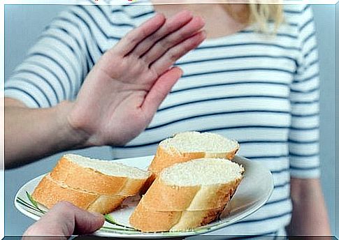 woman refusing a baguette