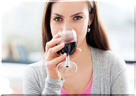 Woman drinking red wine