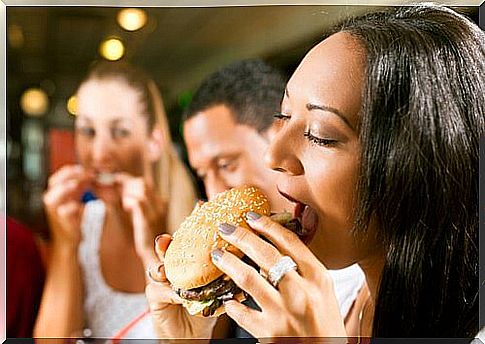 woman eating a hamburger