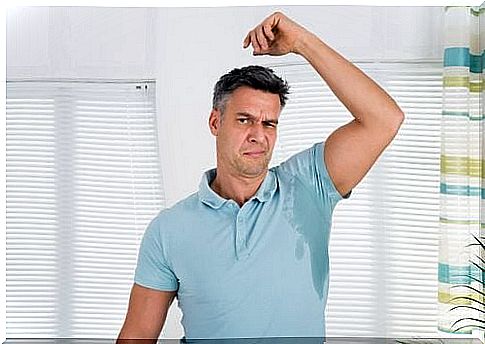 Sweaty man with his arm raised